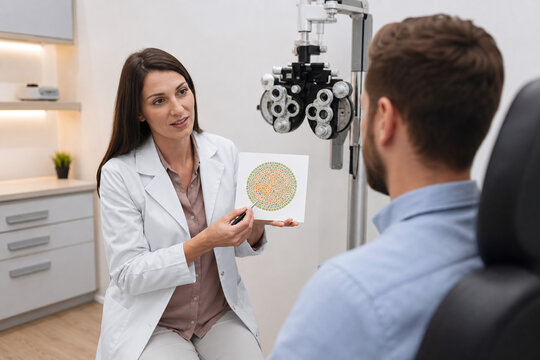 Optometrist conducting color vision test in bright clinic