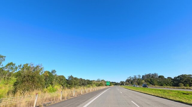 Driving on Pacific Highway Under Clear Blue Sky in Australia