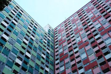 Colorful high-rise apartment building facade from below © egisehungryboy