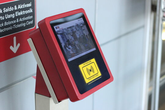 Electronic ticket machine screen at train station gate
