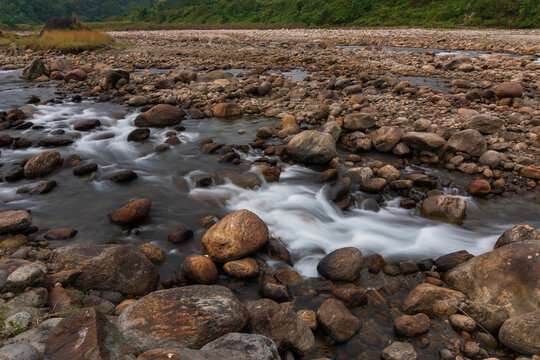Jaldhaka River, flowing through India, Bhutan, and Bangladesh. Originating from Kupup Lake in East Sikkim. Stones at river bed of Joldhaka river, Jhalong - Dooars , north bengal - West Bengal, India.