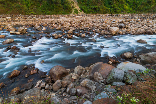 Jaldhaka River, flowing through India, Bhutan, and Bangladesh. Originating from Kupup Lake in East Sikkim. Stones at river bed of Joldhaka river, Jhalong - Dooars , north bengal - West Bengal, India.
