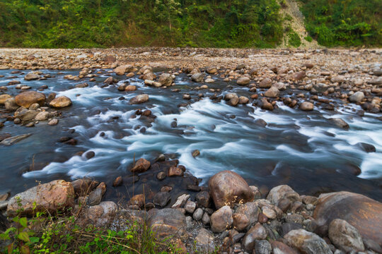 Jaldhaka River, flowing through India, Bhutan, and Bangladesh. Originating from Kupup Lake in East Sikkim. Stones at river bed of Joldhaka river, Jhalong - Dooars , north bengal - West Bengal, India.