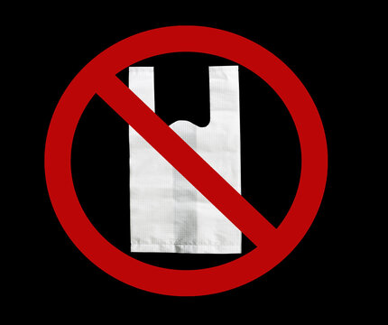 No plastic bag campaign concept with white disposable shopping bag inside a red prohibition symbol on black background. Environmental protection, waste reduction and sustainable consumer behavior.