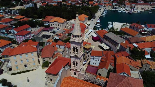 Jelsa town aerial view circling the assumption of mary parish church