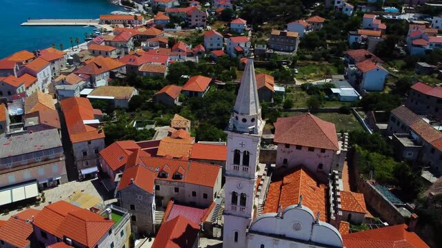 Aerial view of jelsa parish church in hvar, croatia