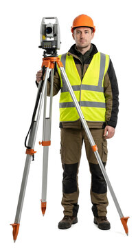 Surveyor in safety vest standing with theodolite on tripod equipment.