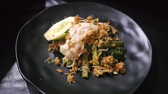 pork chop with potatoes,Pecel is vegetables salad with spicy peanut sauce,traditional food from Java 
