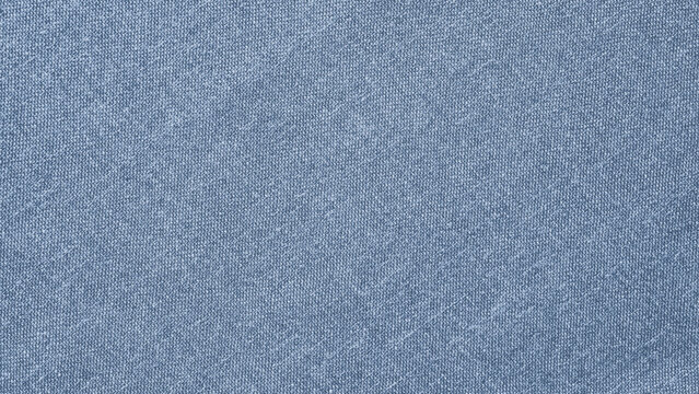 Blue textured fabric background with a soft, woven appearance.