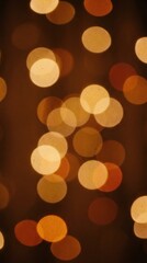 Fototapeta premium Abstract glowing bokeh light circles scattered on dark brown background