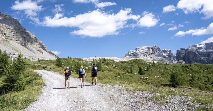 Hikers in front of Rifugio Graffer, Brenta, Brenta-Adamello Natural Park, Trentino, Italy