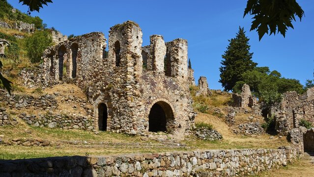 Ancient ruins in an ancient wooded landscape with clear skies, Mystras, Mistra, UNESCO World Heritage Site, Medieval Byzantine ruined city, northwest of Sparta, Taygetos Mountains promontory, Peloponnese, Peninsula, Greece
