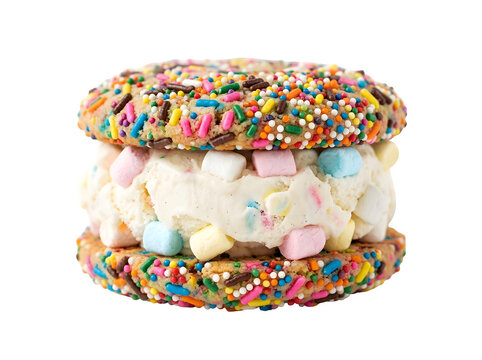A festive cookie ice cream sandwich featuring rainbow sprinkles on the cookies, vanilla ice cream, and colorful mini marshmallows on a black isolated on a transparent background