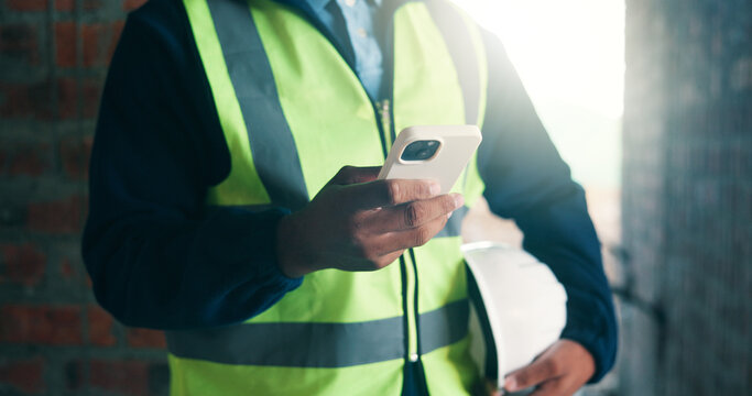 Hands, phone and construction worker at site for development report, chat or online communication. Contractor, mobile and person with text message, project schedule or safety log for building review