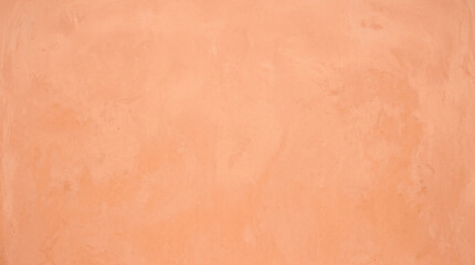 Fototapeta premium Soft peach salmon plaster wall texture background for warm minimal design