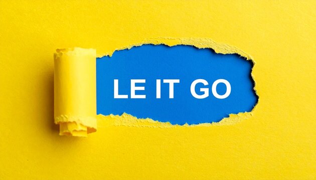 Torn yellow paper revealing LET IT GO text on blue