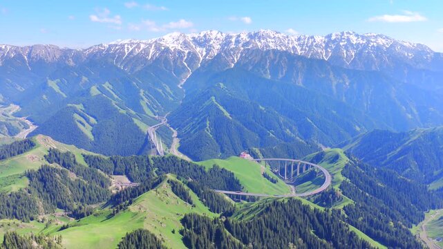 Aerial view of Guozigou Bridge in Yili Xinjiang, Tianshan mountain valley scenery
Highway cable-stayed bridge across alpine canyon near Sayram Lake, northwest China