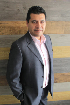 40-year-old Latino executive with a dark skin, successful leader of his business and finance venture