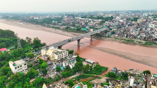 Tawi River bridge surrounded by flood prone housing and poor urban planning during the devastating monsoon Jammu floods.