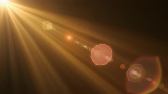 Warm honey sunlight rays sweep across dark background, golden amber, peach glow creating cinematic light overlay with lens flare for filmmaking, video editing, motion graphics, copy space.