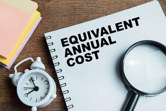 Concept of equivalent annual cost write on book isolated on Wooden Table.