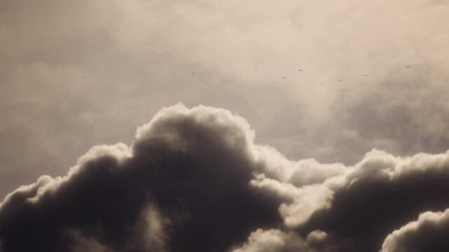 Fleet of Drones Flying Through Sky at Speed Heading to Target. UAV Unmanned Aerial Vehicle. Modern Technology Warfare in the Air. Combat Aircraft. 3D Render. 4K.
