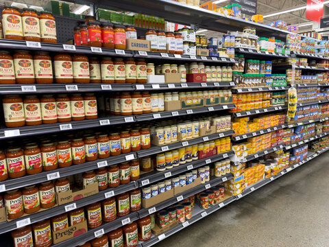 Assorted Pasta Sauces Displayed On Grocery Store Shelves