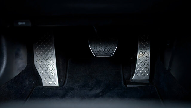 Modern vehicle interior with metallic brake and accelerator gas pedals