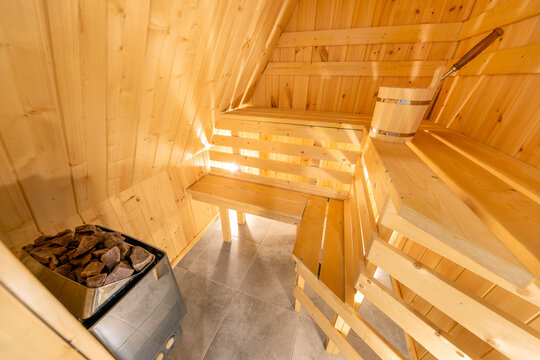  Interior of a traditional wooden Finnish sauna or Russian banya with benches and a bucket in Karelia, Russia