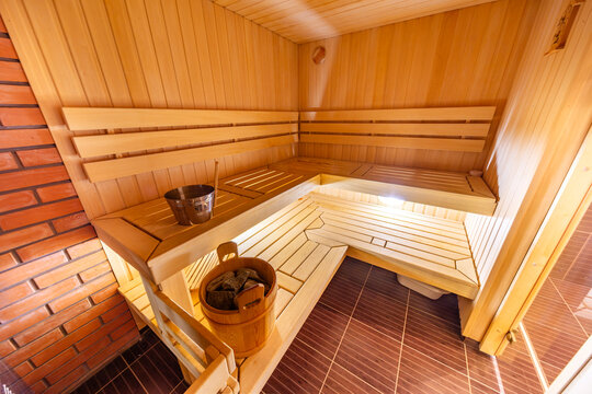  Interior of a traditional wooden Finnish sauna or Russian banya with benches and a bucket in Karelia, Russia