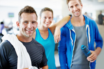 Fototapeta premium Fitness, happy and portrait of people in gym for workout club, support and wellness community. Smile, exercise group and training with friends in sports center for team, connection and health