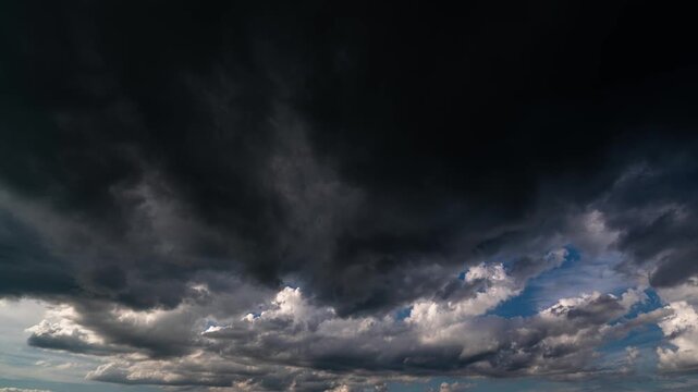 Hope Beyond the Storm Timelapse with Sunlit Sky Surrounded by Dark Clouds
