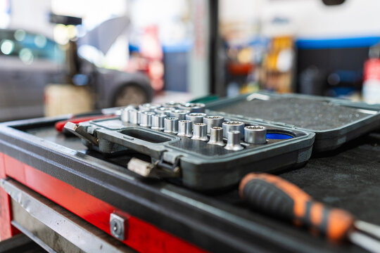 Socket wrench set preparing for vehicle maintenance in workshop