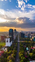 Fototapeta premium Aerial view of modern cityscape with skyscrapers at sunset.