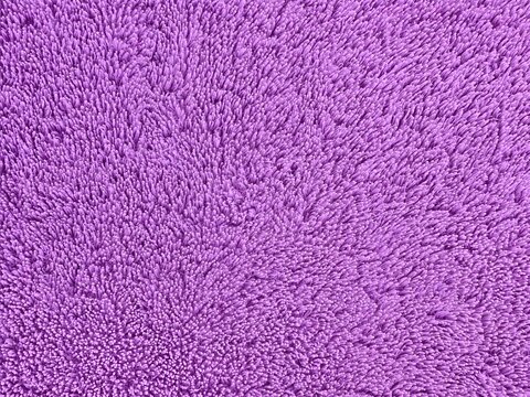 Abstract purple textured fabric surface background with soft pile pattern