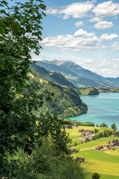 Lungern, Switzerland. Scenic view of Lake Lungern framed by forest and Swiss Alpine mountains from Ch&auml;lr&uuml;tirank Viewpoint