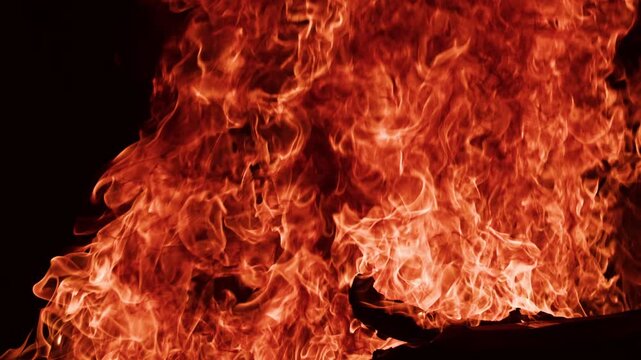 Fire flames dancing freely. Fire slow motion burning organic movement. Fire slow motion glowing warm light. Fire slow motion cinematic.