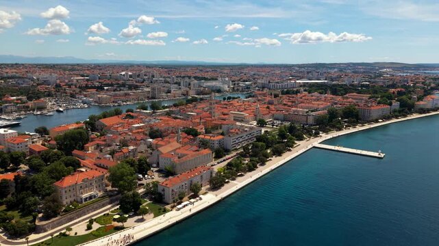 Scenic Zadar old town, Croatia. Waterfront Riva promenade next to the blue Adriatic Sea. Aerial drone