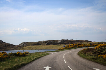 Wee Mad Road view by sunny noon, between Lochinver and Kylesku, North Scotland © free2trip