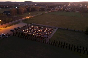 Fototapeta premium Night cemetery glowing with candles honoring Polish tradition