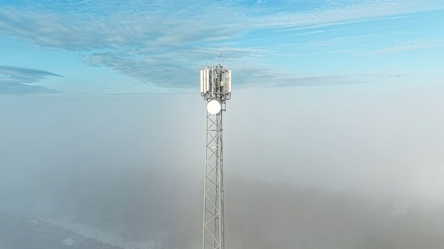 Snowy mountain landscape with a modern cellular mast