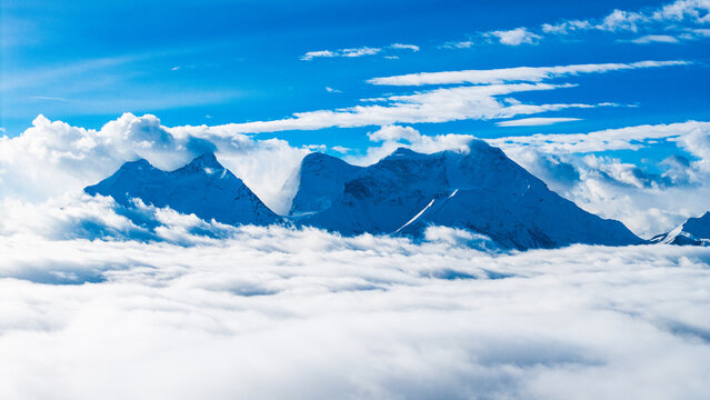 Aerial Drone View of Sea of Clouds at Mengdala Pass and Kula Kangri Snow Mountain in Shannan, Tibet, China