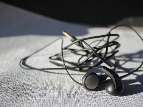 Black Wired Earphones with Tangled Cable and 3.5mm Jack