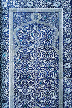 Blue and white ceramic tilework with intricate floral arabesque patterns at Pakhlavan Makhmoud Mausoleum in Khiva, Uzbekistan. Ideal for cultural heritage, travel, and design projects.