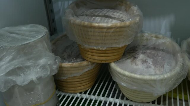 Bread Dough Proofing in Banneton Baskets Inside Refrigerator, Bakery Fermentation Process