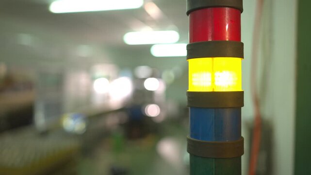 Status indicator lights used for monitoring and controlling processes in large-scale bottled beverage production lines