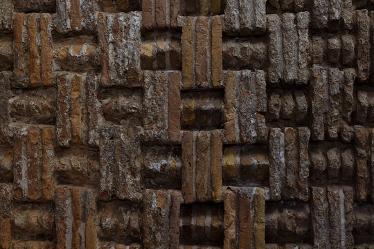 Decorative brickwork detail of the Ismail Samani Mausoleum in Bukhara showing intricate basket-weave pattern. Ideal for architecture, heritage, and texture-focused design projects.