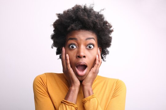Young Black woman with shocked facial expression