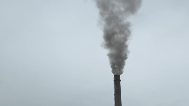 Black smoke coming from a thermal power plant chimney, clean air, ecology, environmental protection