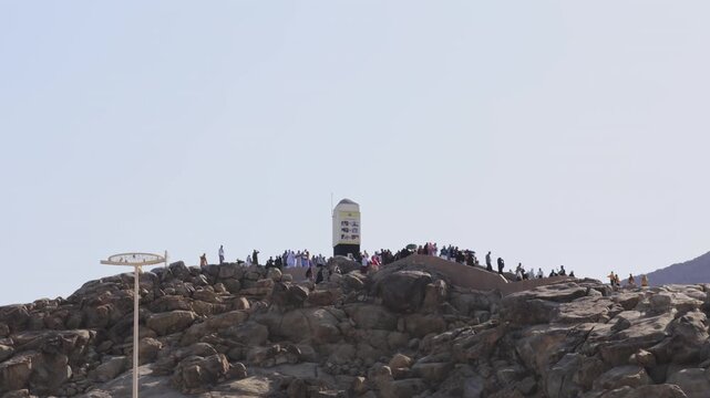 Muslim pilgrims gathering on Mount Arafat (Jabal al-Rahmah) during Hajj pilgrimage